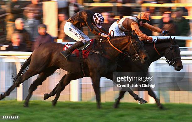 Keltic Cliche ridden by Simon Elliott goes past Prophets Honor ridden by Jack Doyle to win The Romney Marsh Mares Intermediate Open National Hunt...