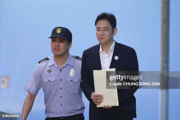 Samsung Group heir Lee Jae-yong leaves the Seoul Central District Court following his verdict in Seoul on August 25, 2017. The heir to the Samsung...