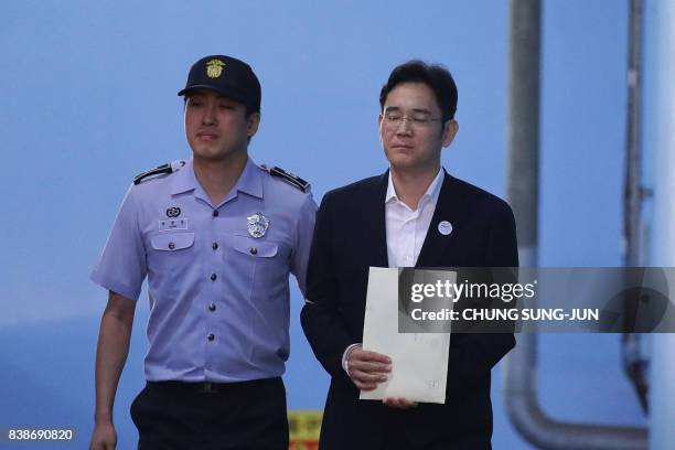 Samsung Group heir Lee Jae-yong leaves the Seoul Central District Court following his verdict in Seoul on August 25, 2017. The heir to the Samsung...