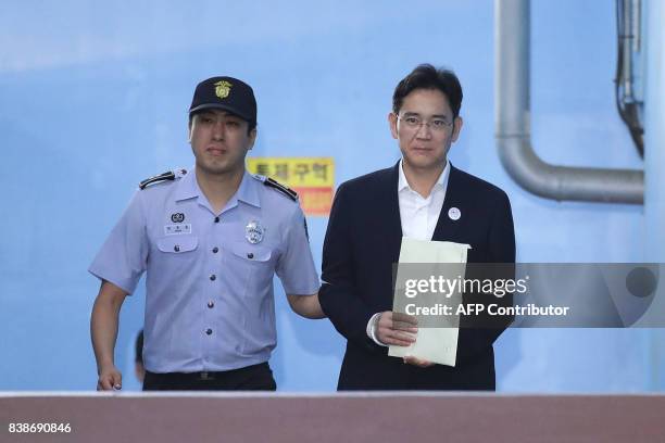 Samsung Group heir Lee Jae-yong leaves the Seoul Central District Court following his verdict in Seoul on August 25, 2017. The heir to the Samsung...