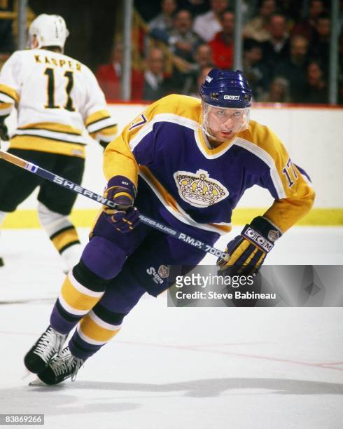 Jim Carson of the Los Angeles Kings skates against the Boston Bruins at Boston Garden.