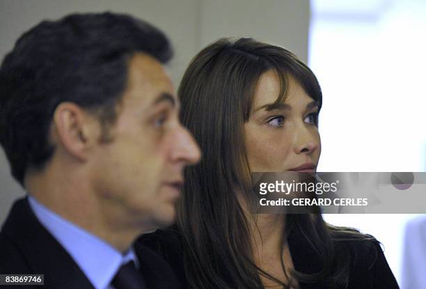 French President Nicolas Sarkozy's and his wife Carla Bruni Sarkozy visit a special unit for HIV/AIDS sufferers at the Saint-Louis Hospital in Paris...