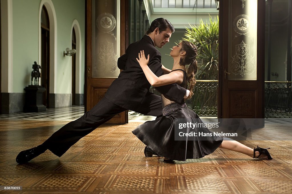 Young couple tango dancing 