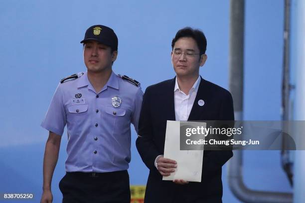 Lee Jae-yong, vice chairman of Samsung Electronics Co., leave after his verdict trial at the Seoul Central District Court on August 25, 2017 in...