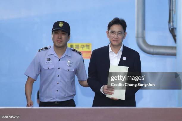 Lee Jae-yong, vice chairman of Samsung Electronics Co., leave after his verdict trial at the Seoul Central District Court on August 25, 2017 in...