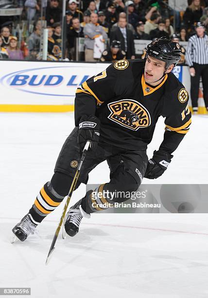 Milan Lucic of the Boston Bruins skates up the ice in a game against the Detroit Red Wings at the TD Banknorth Garden on November 29, 2008 in Boston,...