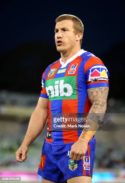 Trent Hodkinson of the Knights is pictured with 'Hannah' on his forearm taping out of respect for the passing of Hannah Rye during the round 25 NRL...