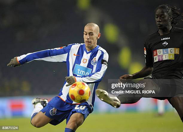 Porto's Argentinian Tomas Costa vies with Academica's Ederzito Lopes "Eder" from Guinea during their Portuguese First league football match at the...
