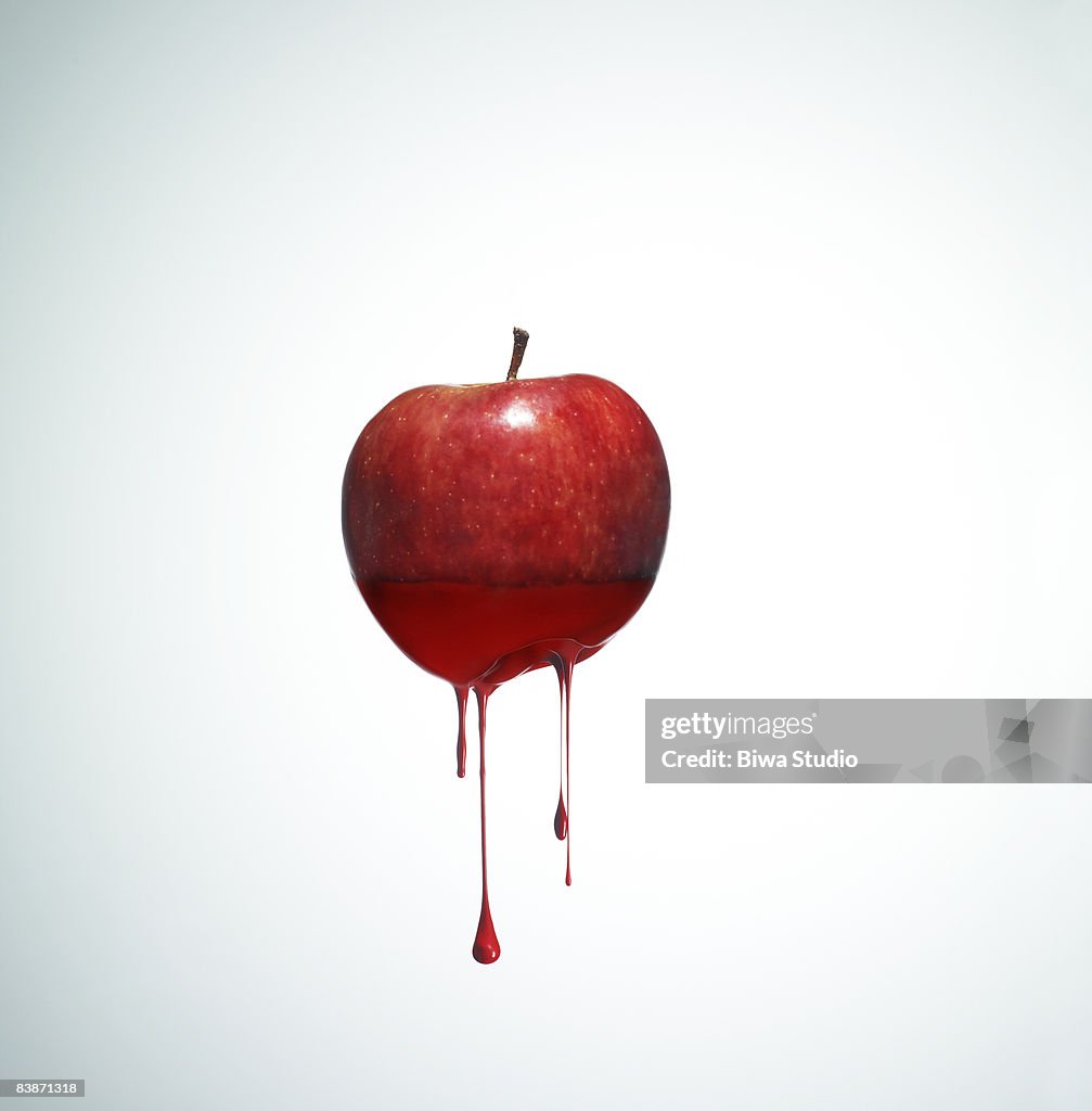 Apple with drippy red ink
