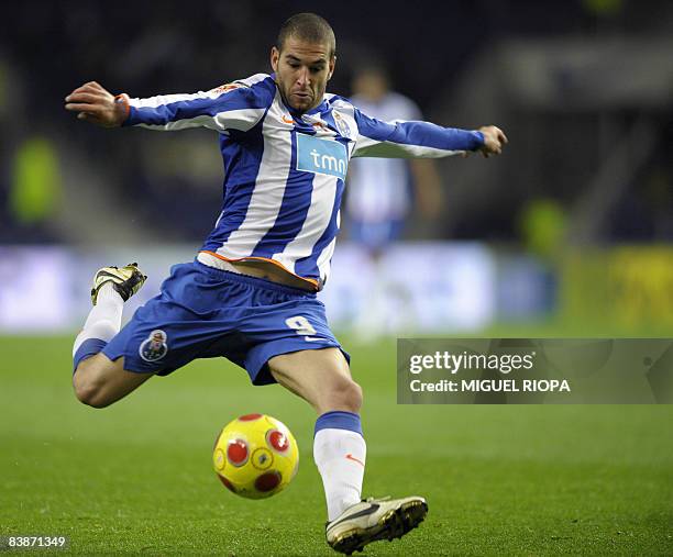Porto's Argentinian Lisandro Lopez kicks the ball during their Portuguese First league football match Academica at the Dragao Stadium in Porto, on...