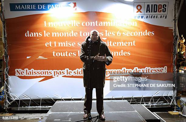 Paris's mayor deputy in charge on Health issues, Jean-Marie Le Guen delivers a speech in front of a giant screen, which displays the numbers of...