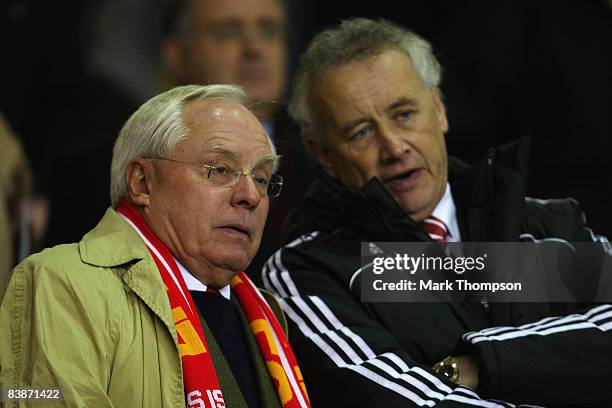 Liverpool Co-owner George Gillett chats to Director Rick Parry prior to the Barclays Premier League match between Liverpool and West Ham United at...