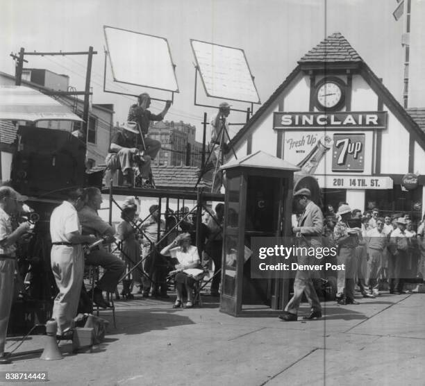 Here's another of the scenes filmed at the "Civic Center filling station" Monday. Stewart enters a telephone booth to call his girl friend, played by...