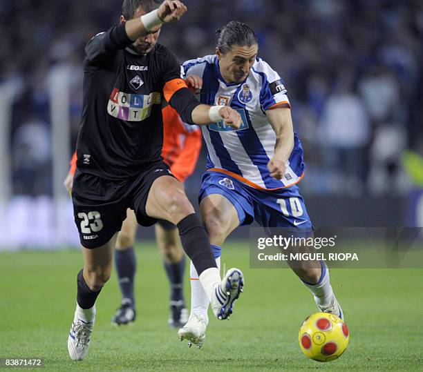 Porto's Argentinian Cristian Rodriguez vies with Academica's Serbian Milos Pavlovic during their Portuguese First league football match at the Dragao...