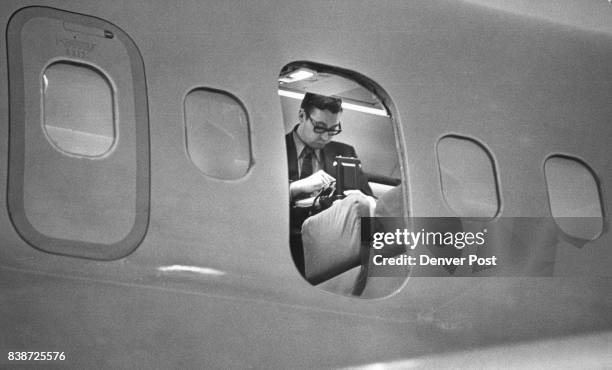 An FBI agent checks the hijacked DC-9. Denver police entered the plane after it landed and found bomb they described as "a workable incendiary...