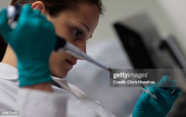 Marina Kemelman, Research Associate at the AIDS Vaccine Design and Development Laboratory, collects bacteria transfected with DNA as part of research...