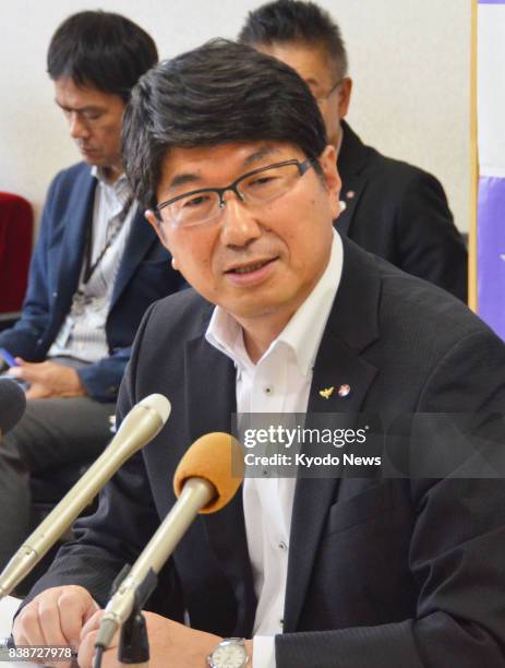 At a press conference in the southwestern Japan city of Nagasaki on Aug. 25 Mayor Tomihisa Taue announces he will attend the signing ceremony of the...