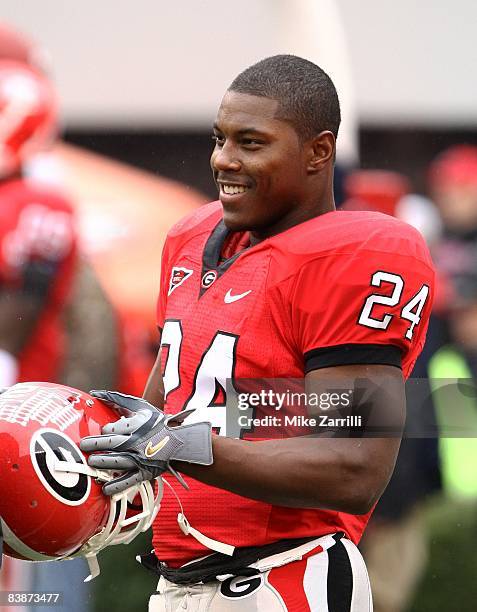 Running back Knowshon Moreno of the Georgia Bulldogs takes a break during pre-game warm-up before the game against the Georgia Tech Yellow Jackets at...