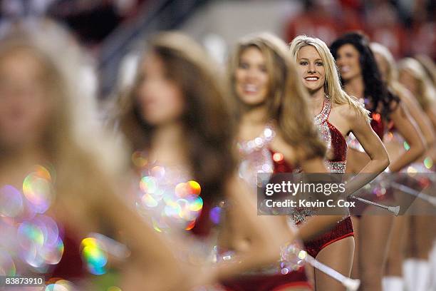 The flag girls of the Alabama Crimson Tide marching band perform before the game against the Mississippi State Bulldogs at Bryant-Denny Stadium on...