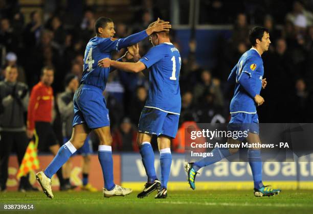 Birmingham City's Adam Rooney is congratulated by team mate Curtis Davies after he score the opening goal of the game during the UEFA Europa League,...