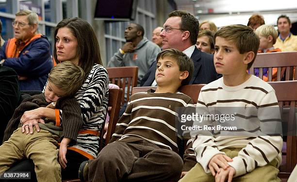 Kathleen Swinney, wife of new head coach Dabo Swinney of the Clemson Tigers, sits with there three sons Clay, Drew, and Will during a press...
