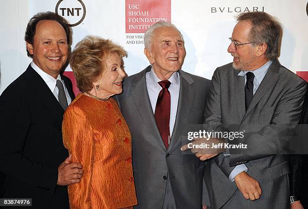 Host Billy Crystal, producer Anne Buydens, husband honoree Kirk Douglas and director Steven Spielberg attend Steven Spielberg's annual Ambassadors...