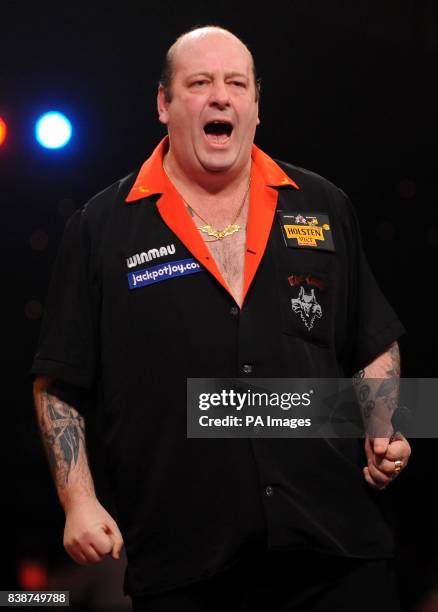 England's Ted Hankey celebrates victory over Martin Atkins in the quarter finals of the BDO World Professional Darts Championships at the Lakeside...