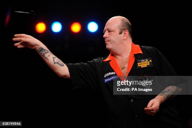 England's Ted Hankey in action against Martin Atkins in the quarter finals of the BDO World Professional Darts Championships at the Lakeside Complex,...