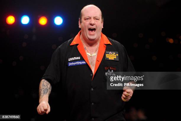 England's Ted Hankey celebrates victory over Martin Atkins in the quarter finals of the BDO World Professional Darts Championships at the Lakeside...