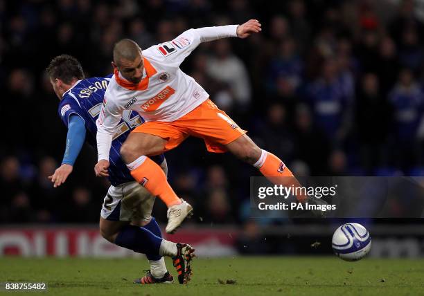 Blackpool's Kevin Phillips and Ipswich Town's Josh Carson battle for the ball during the npower Championship match at Portman Road, Ipswich.