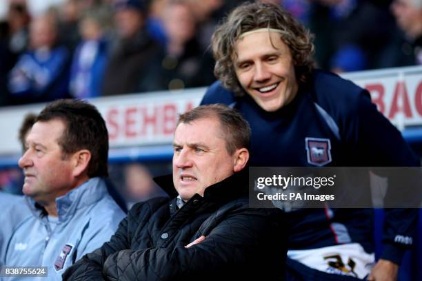 Ipswich Town manager Paul Jewell looks on from the touchline as player Jimmy Bullard jokes behind him during the npower Championship match at Portman...