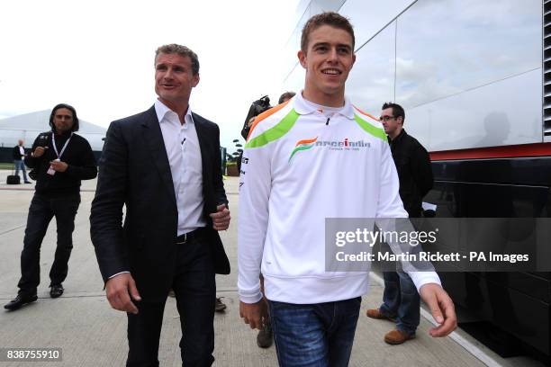 Force India's Paul di Resta arrives with BBC F1 Pundit andf former driver David Coulthard at Silverstone during paddock day for the Formula One...