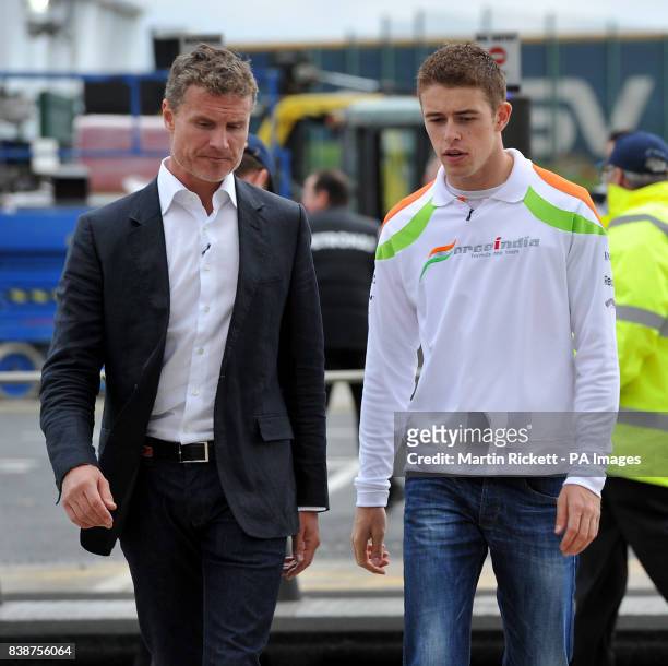 Force India's Paul di Resta arrives with BBC F1 Pundit andf former driver David Coulthard at Silverstone during paddock day for the Formula One...