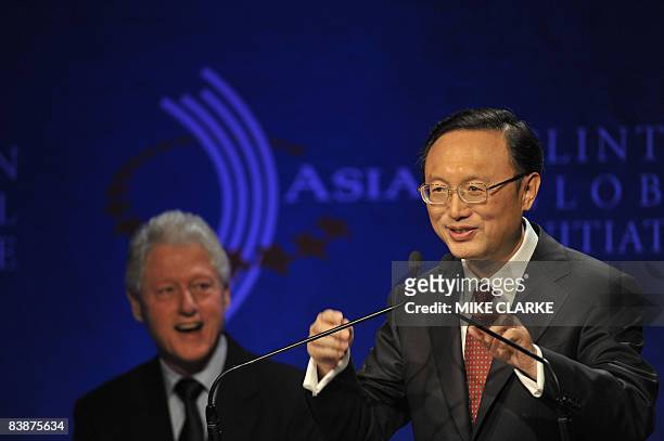 Former US president Bill Clinton listens while Yang Jiechi Foreign Minister of China speaks at the Clinton Global Initiative in Hong Kong on December...