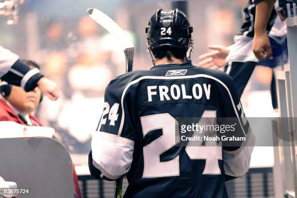 Alexander Frolov of the Los Angeles Kings high fives fans as he takes the ice during warmups prior to the game against the Toronto Maple Leafs on...