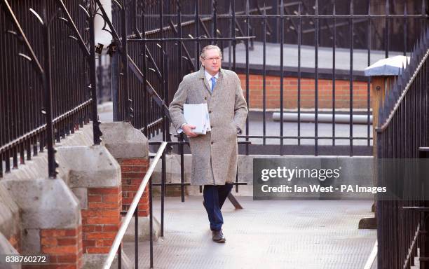 John Witherow, editor of The Sunday Times arrives at the Leveson enquiry at the Royal Courts of Justice in London.