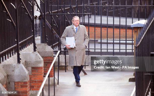 John Witherow, editor of The Sunday Times arrives at the Leveson enquiry at the Royal Courts of Justice in London.