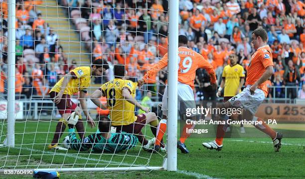 Arsenal goalkeeper Jens Lehmann and Francesc Fabregas scramble the ball off the line after a shot from Blackpool's Dudley Campbell