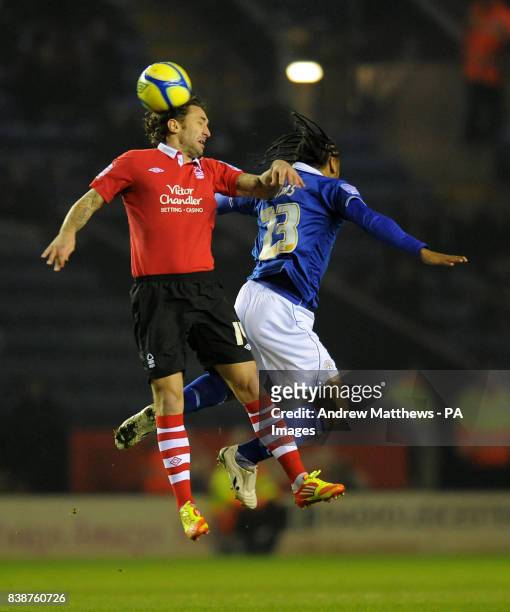 Leicester City's Neil Danns and Nottingham Forest's Jonathan Greening jump for the ball during the FA Cup Third Round Replay at the King Power...