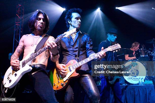 Guitarist Dave Navarro, musician Billy Morrison, bass guitarist Chris Chaney, and drummer Matt Sorum perform at the Official Grand Opening of Galpin...