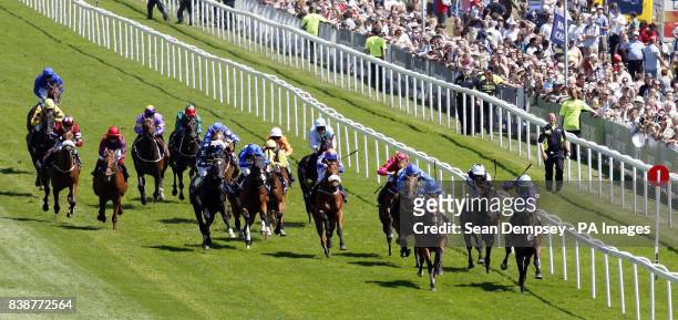 Dance and Dance ridden by jockey Ryan Moore wins the Investec Mile during Ladies Day at the Investec Derby Festival, Epsom Downs Racecourse.