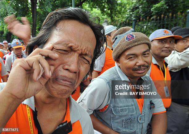 Man , victim of Indonesia's Lapindo mud volcano, expresses his sadness during a protest in front of the Presidential Palace in Jakarta on December 2,...