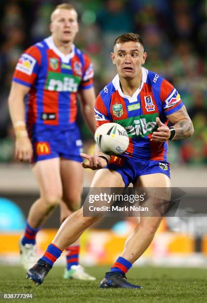 Danny Levi of the Knights passes during the round 25 NRL match between the Canberra Raiders and the Newcastle Knights at GIO Stadium on August 25,...