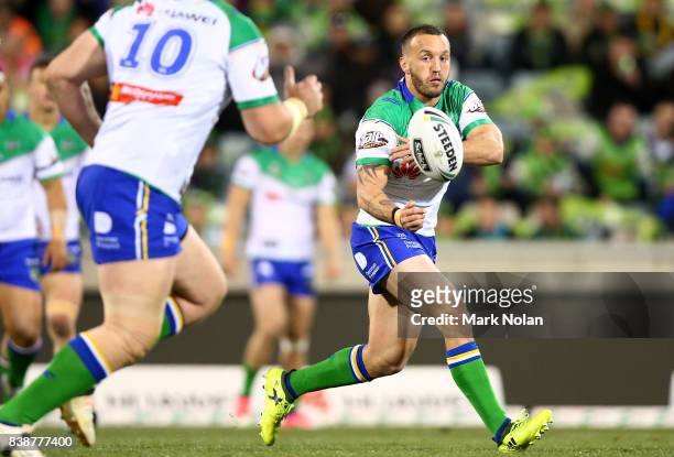 Josh Hodgson of the Raiders passes during the round 25 NRL match between the Canberra Raiders and the Newcastle Knights at GIO Stadium on August 25,...