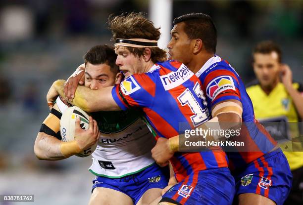 Nikola Cotric of the Raiders is tackled by Lachlan Fitzgibbon of the Knights during the round 25 NRL match between the Canberra Raiders and the...