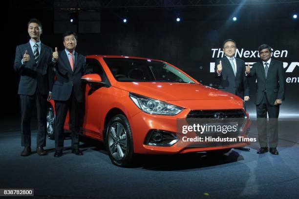 Ha, design director, Hyundai Motor Company, YK Koo, MD and CEO, Hyundai Motor India Ltd, and SJ Ha along with Rakesh Srivastava, directors - sales...