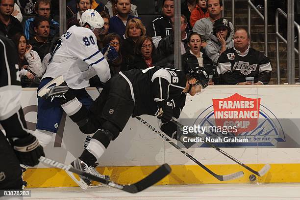 Nik Antropov of the Toronto Maple Leafs checks against Michal Handzus of the Los Angeles Kings into the boards during the game on December 1, 2008 at...