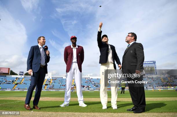 England captain Joe Root tosses the coin alongside West Indies captain Jason Holder ahead of day one of the 2nd Investec Test between England and the...