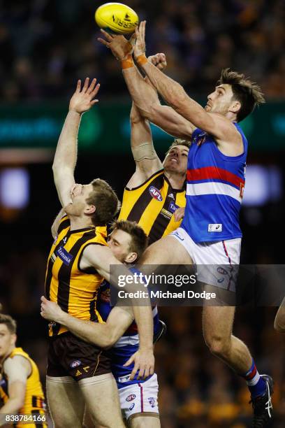 Tom Campbell of the Bulldogs compete for the ball during round 23 AFL match between the Hawthorn Hawks and the Western Bulldogs at Etihad Stadium on...