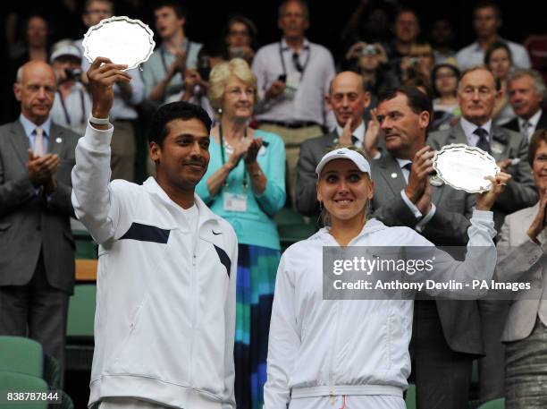 India's Mahesh Bupathi and Russia's Elena Vesnina with their runners up plate after defeat to Austria's Jurgen Melzer and Czech Republic's Iveta...
